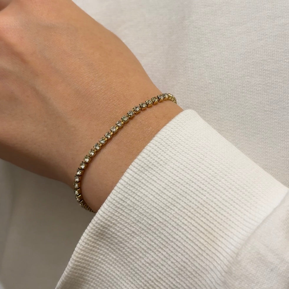 Golden tennis bracelet